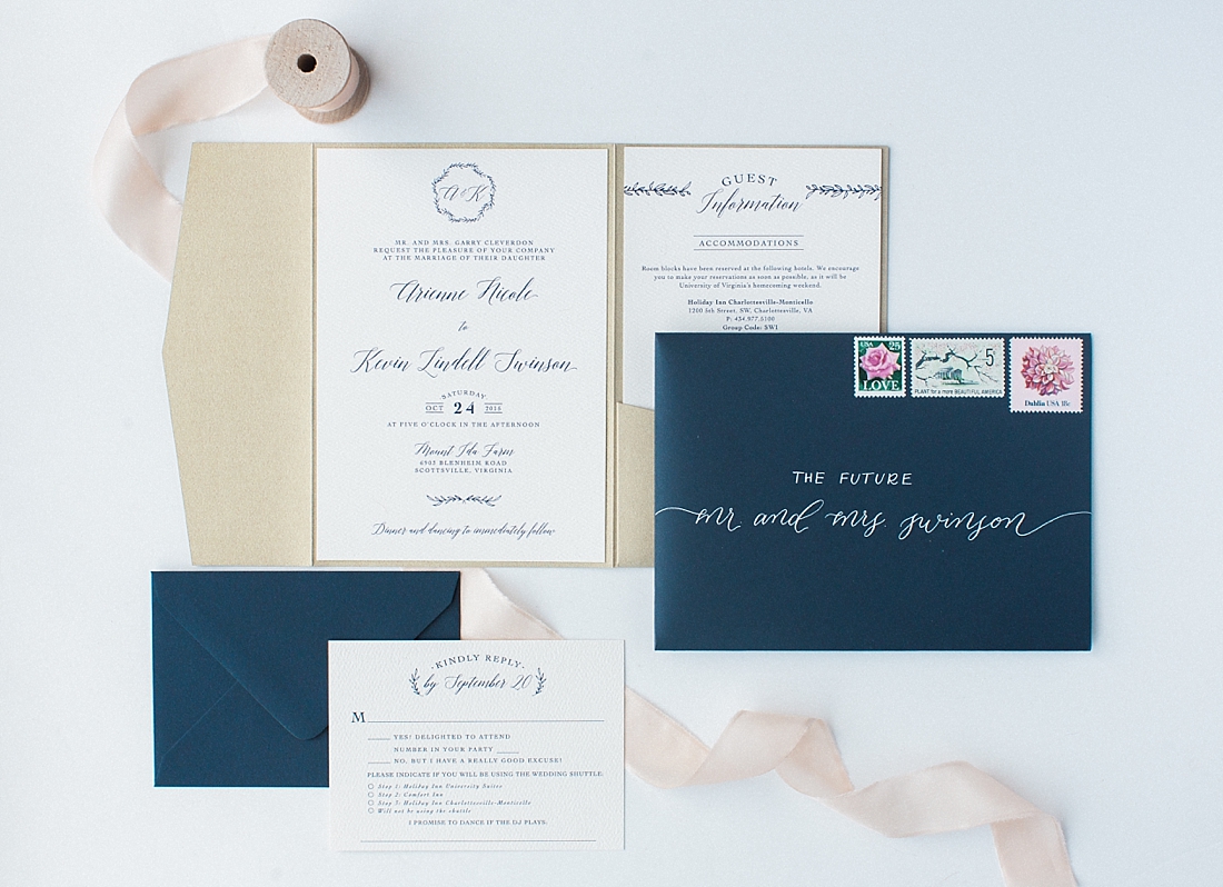 White ink calligraphy on navy envelope | Abby Grace